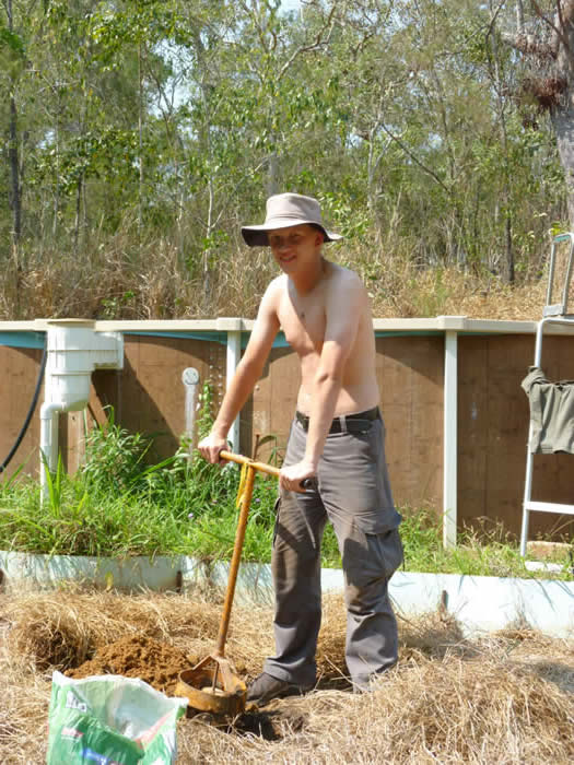 Joonas digging post holes for the Dragon fruit trellis
